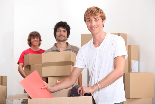 Removalist team packing items securely for transport